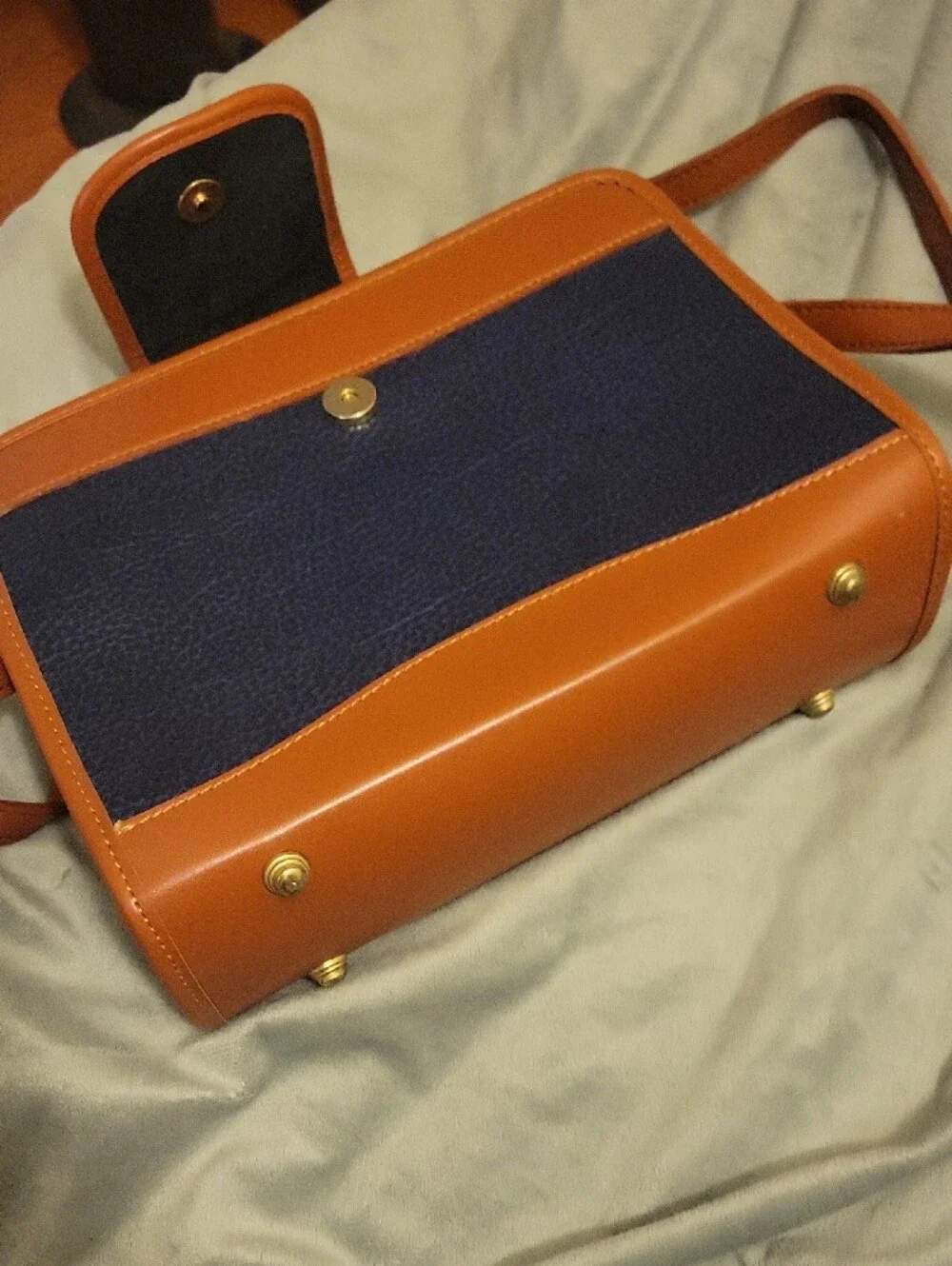 Dooney & Bourke Navy and Tan Pebbled Leather Crossbody